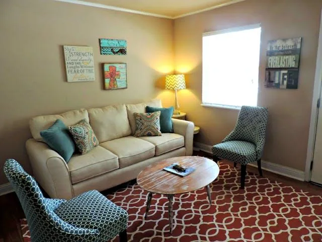 living room with blue chairs